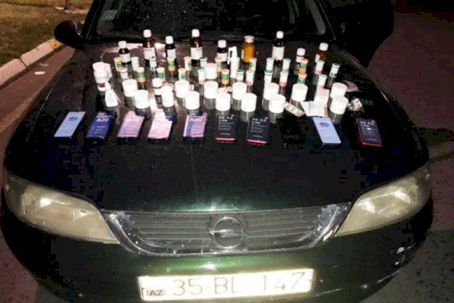    Maşının mühərrikindən dərman və telefonlar çıxdı   