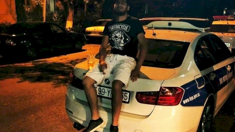    Bakıda polis maşınının üzərində pivə içən şəxs saxlanıldı - Foto   