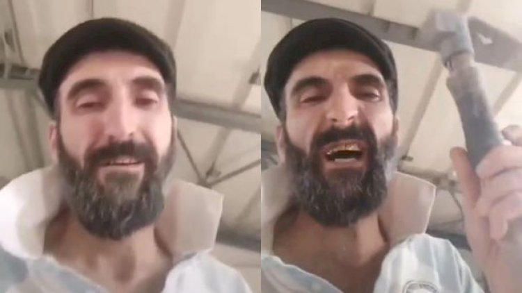    Polis əlində çəkiclə metroya daxil olan şəxsi axtrarır   